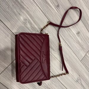 Tory Burch bag. Used it less than 10 times.